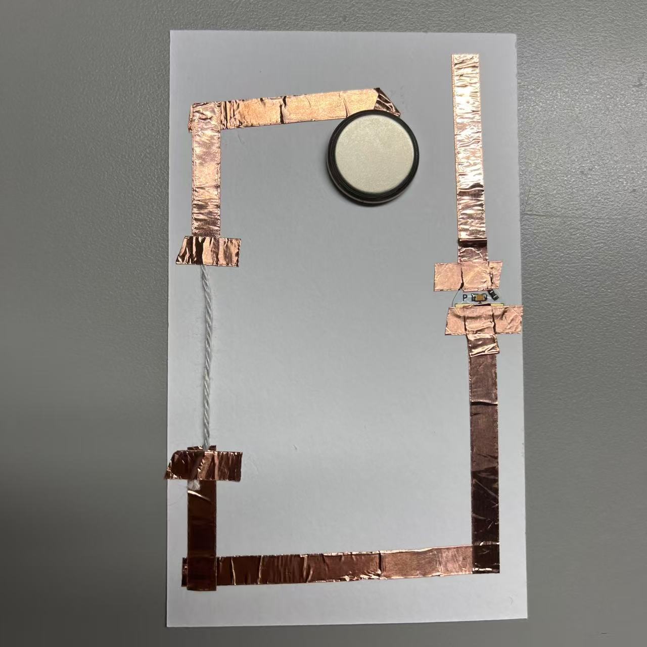 Use the wool to complete the circuit by energizing it.