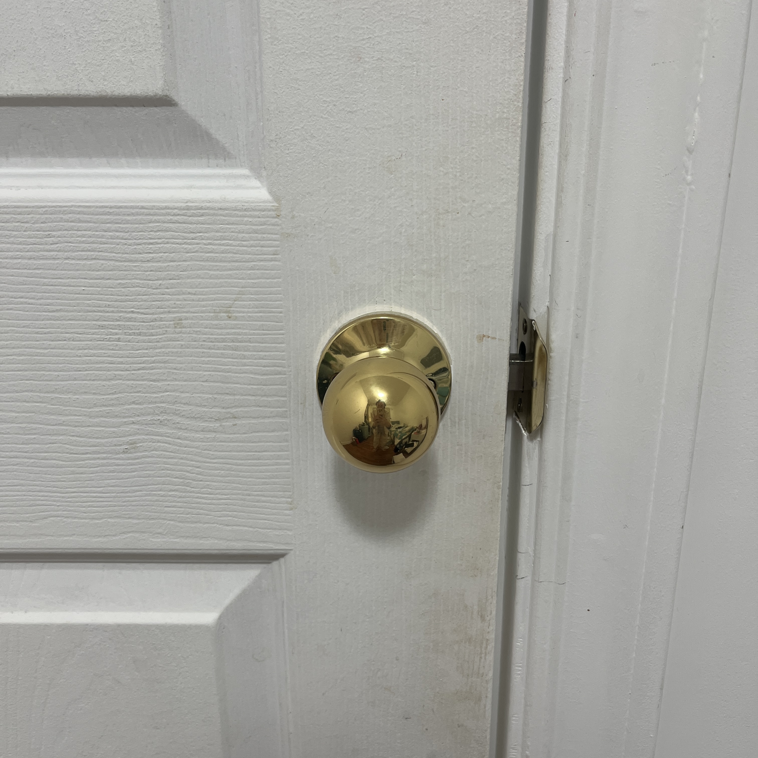 The sound of a doorknob.