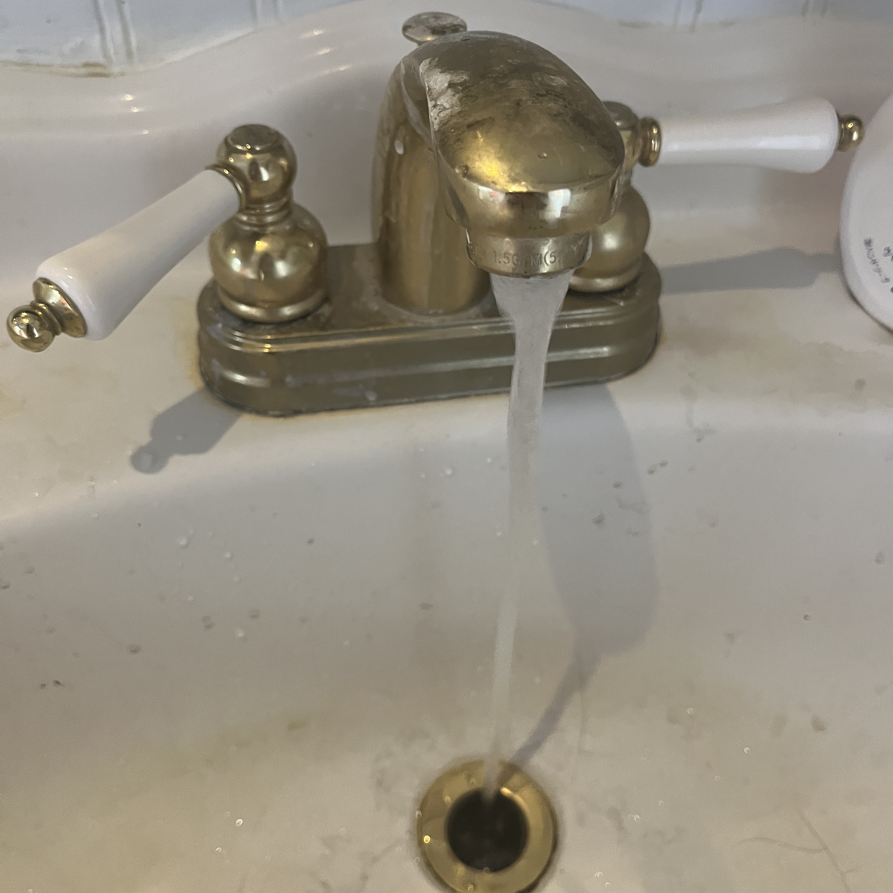 The sound of the faucet.