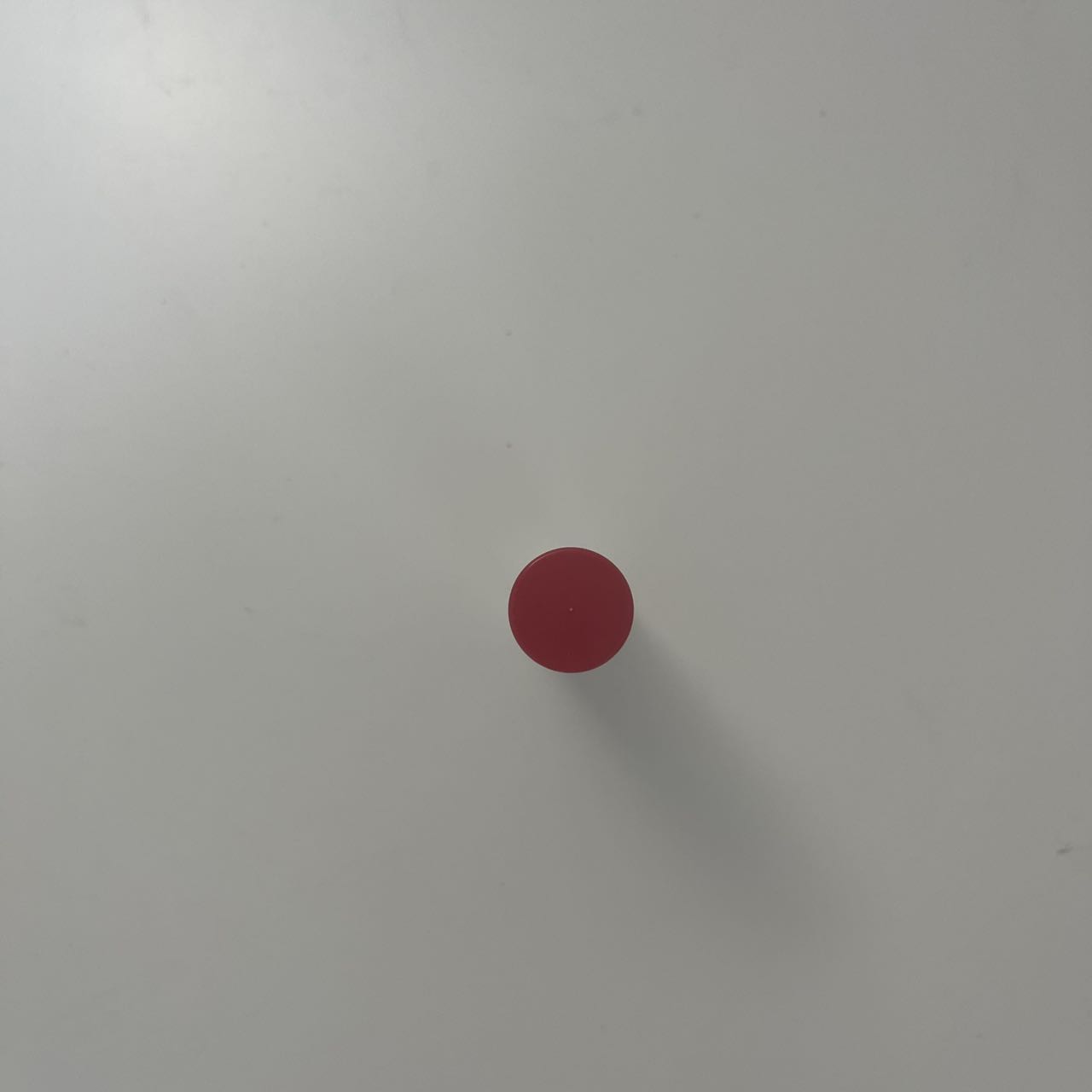 The photo taken from the top of the lipstick is a standard round shape